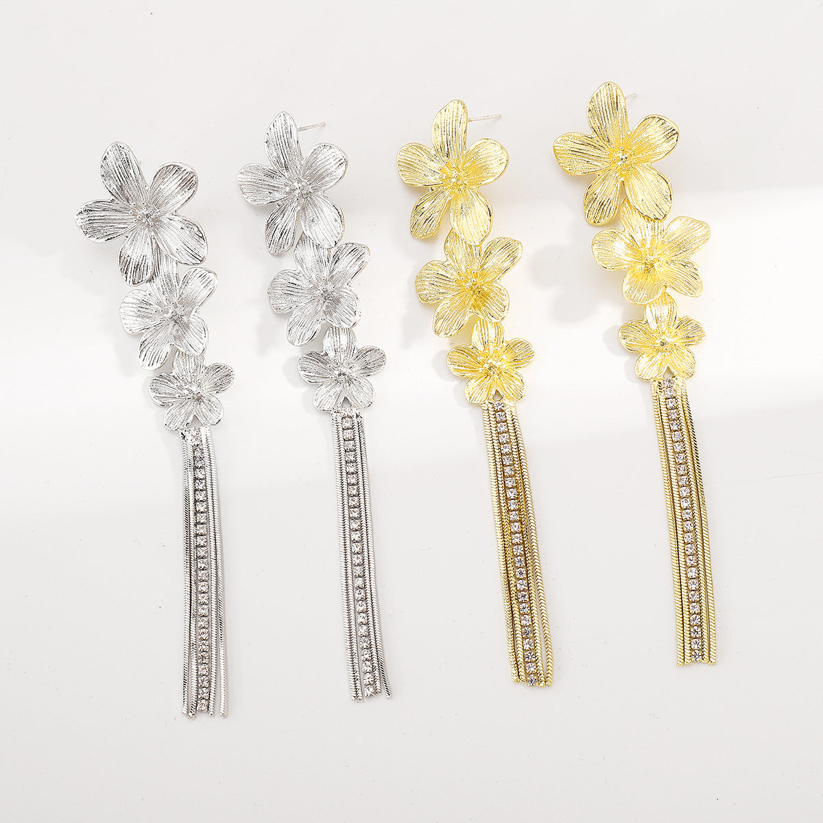 ARETES LARGOS FLORALES