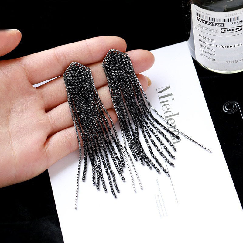 ARETES FLECOS NEGROS