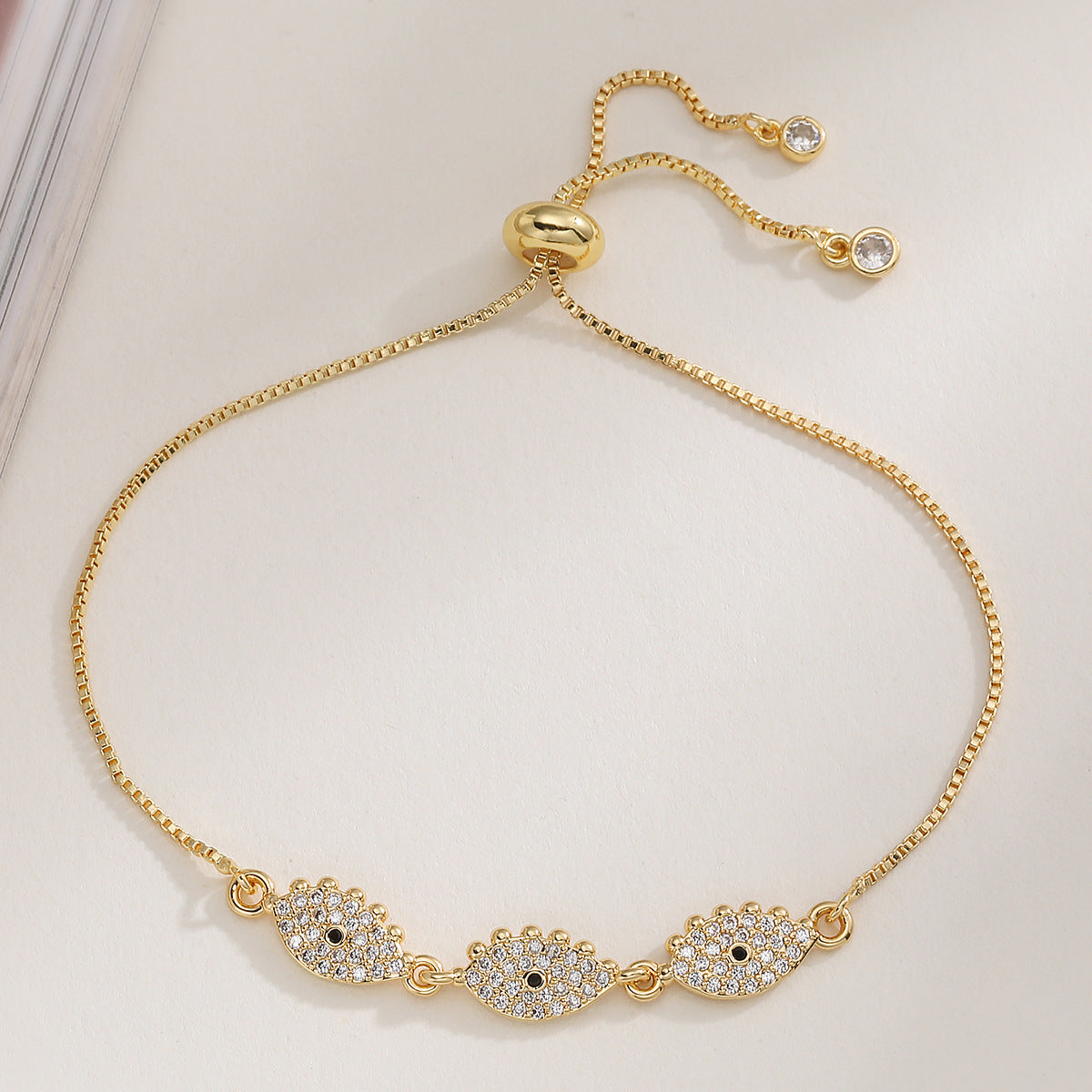 PULSERA OJOS ZIRCONIAS