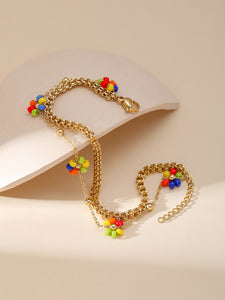PULSERA FLORES ARCOÍRIS
