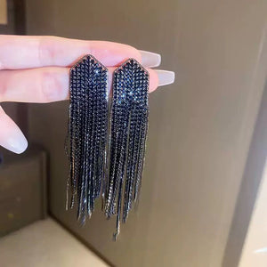 ARETES FLECOS NEGROS